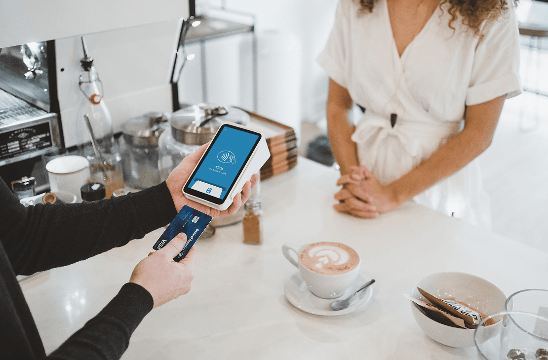 Paying with a phone in a cafe